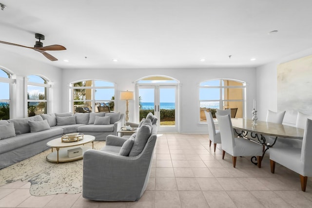 living room with light tile patterned floors and ceiling fan