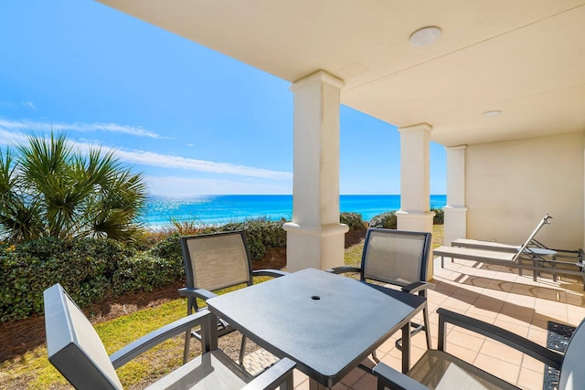 view of patio with a water view