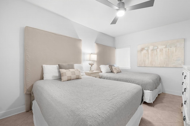 tiled bedroom with ceiling fan