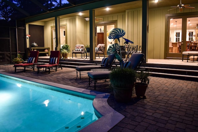 view of pool featuring french doors, ceiling fan, and a patio area