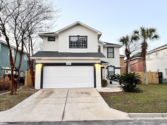 view of front property with a garage and a front yard