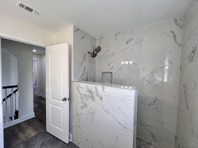 bathroom featuring walk in shower and hardwood / wood-style floors