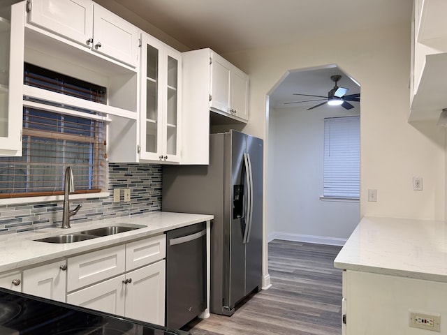 kitchen featuring ceiling fan, appliances with stainless steel finishes, sink, and white cabinets