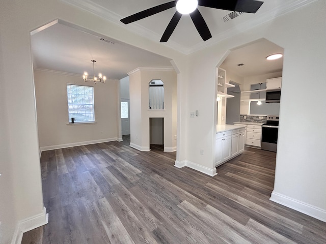 unfurnished living room with ornamental molding, dark hardwood / wood-style floors, and ceiling fan with notable chandelier