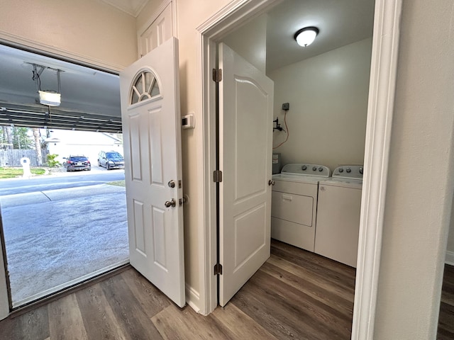 laundry room with hardwood / wood-style flooring and independent washer and dryer