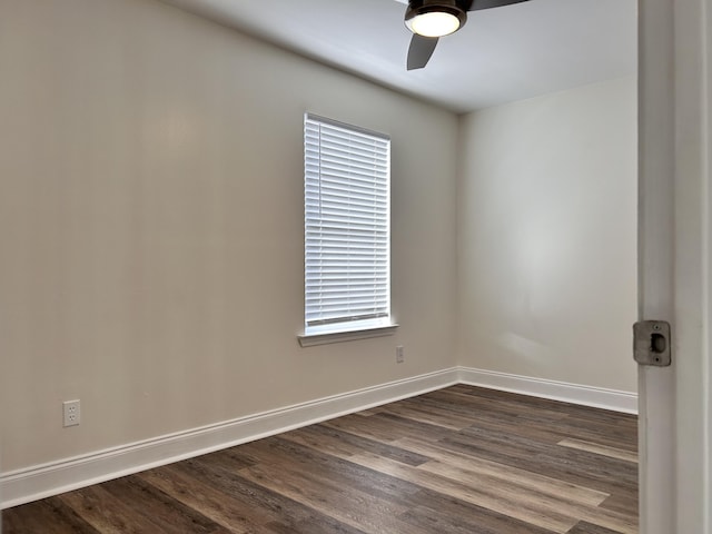 empty room with dark hardwood / wood-style floors and ceiling fan