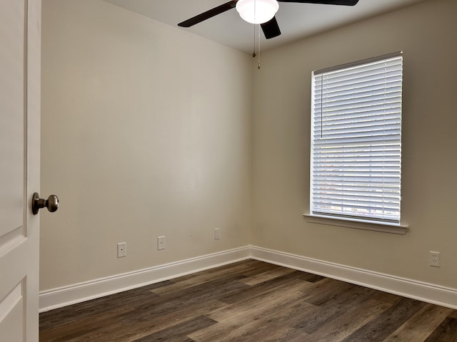 unfurnished room with dark wood-type flooring and ceiling fan