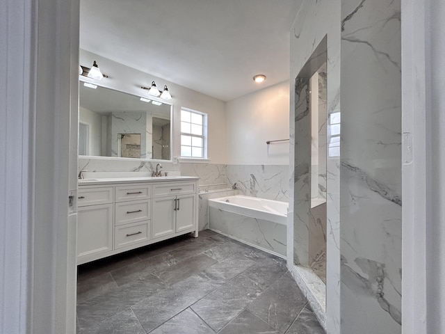 bathroom with vanity and independent shower and bath