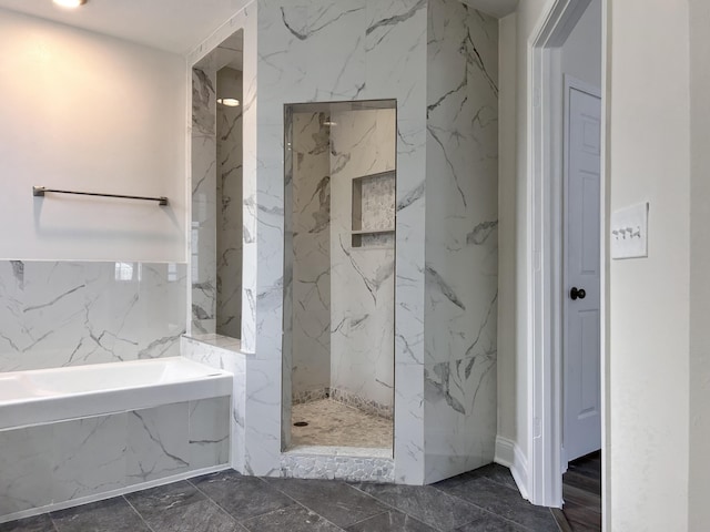 bathroom featuring shower with separate bathtub