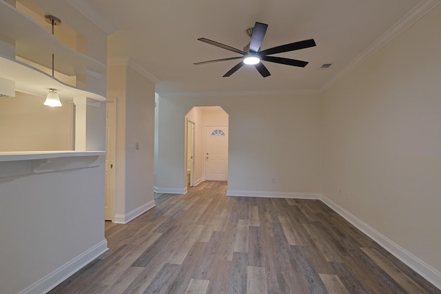 149 Legion Park Loop, Miramar Beach, FL 32550 - spare room with ceiling fan, wood finished floors, arched walkways, crown molding, and baseboards