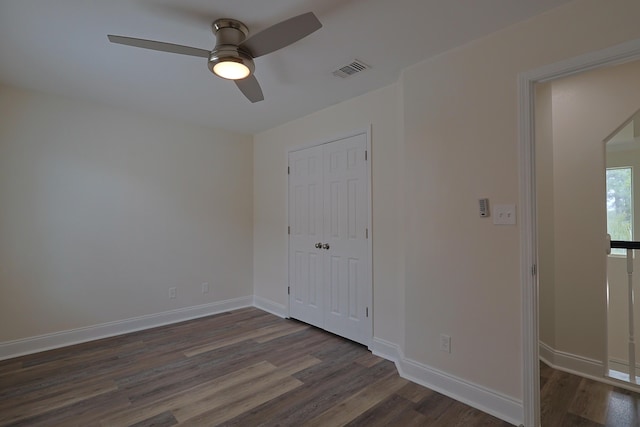 149 Legion Park Loop, Miramar Beach, FL 32550 - unfurnished bedroom featuring dark wood-type flooring, baseboards, a closet, and a ceiling fan