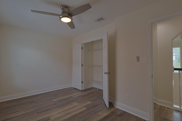 149 Legion Park Loop, Miramar Beach, FL 32550 - unfurnished bedroom with wood finished floors, baseboards, a closet, and ceiling fan