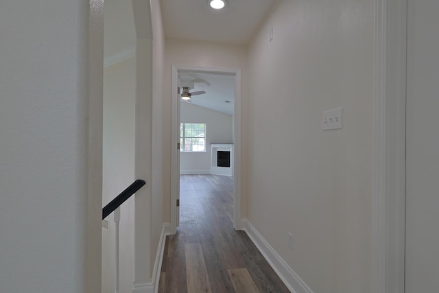 149 Legion Park Loop, Miramar Beach, FL 32550 - hallway featuring vaulted ceiling, dark wood finished floors, and baseboards