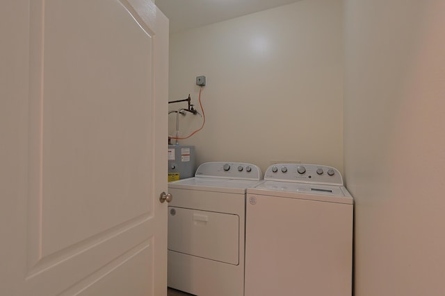 149 Legion Park Loop, Miramar Beach, FL 32550 - laundry room featuring washer and dryer and water heater