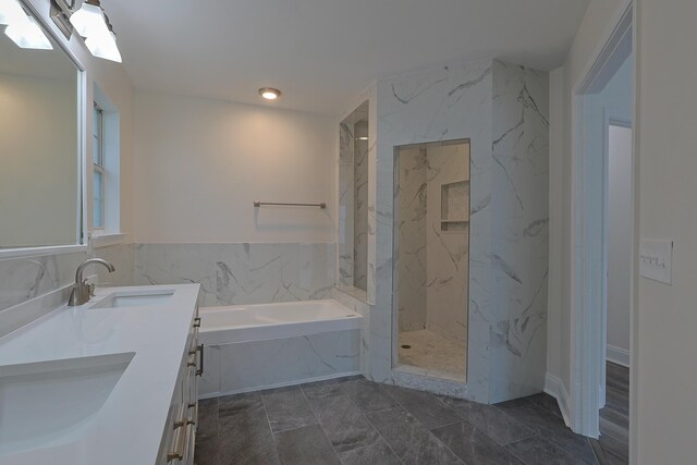 149 Legion Park Loop, Miramar Beach, FL 32550 - bathroom featuring a bath, double vanity, and a marble finish shower