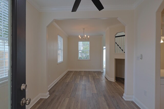 149 Legion Park Loop, Miramar Beach, FL 32550 - unfurnished dining area with wood finished floors, arched walkways, a chandelier, ornamental molding, and baseboards