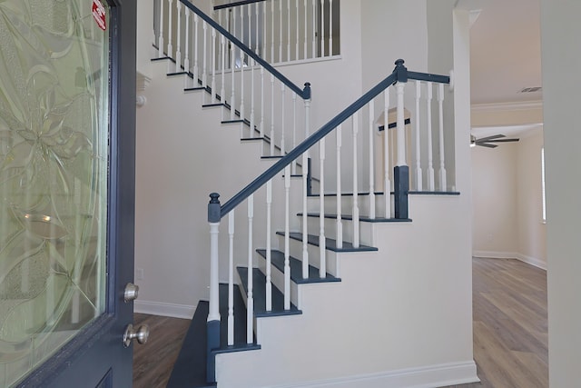 149 Legion Park Loop, Miramar Beach, FL 32550 - stairway featuring wood finished floors, baseboards, ornamental molding, and ceiling fan