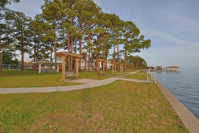 149 Legion Park Loop, Miramar Beach, FL 32550 - surrounding community with a water view, a lawn, and a dock