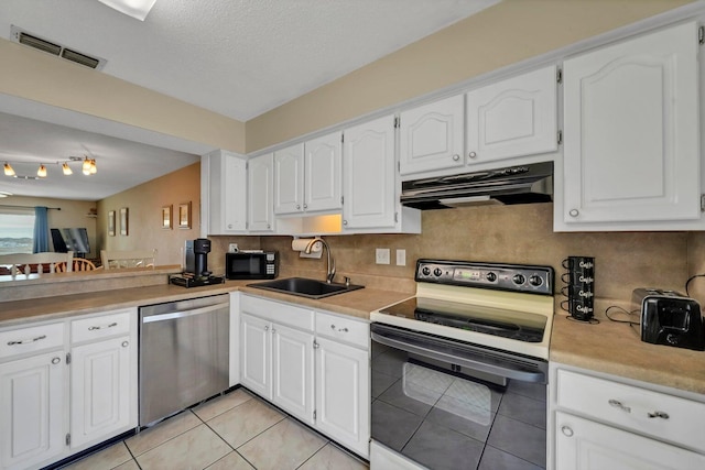 8468 Gulf Blvd # Ut-4, Navarre, FL 32566 - kitchen with tasteful backsplash, sink, white cabinets, light tile patterned floors, and black appliances