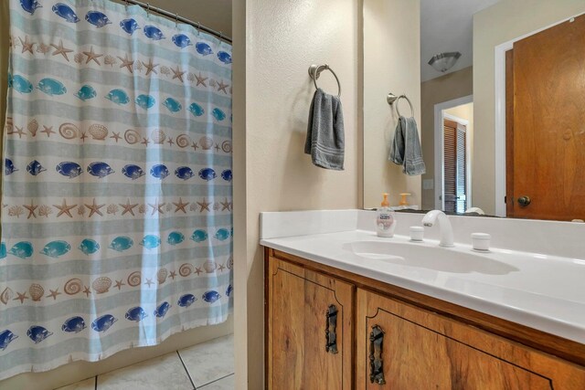 8468 Gulf Blvd # Ut-4, Navarre, FL 32566 - bathroom featuring walk in shower, tile patterned floors, and vanity