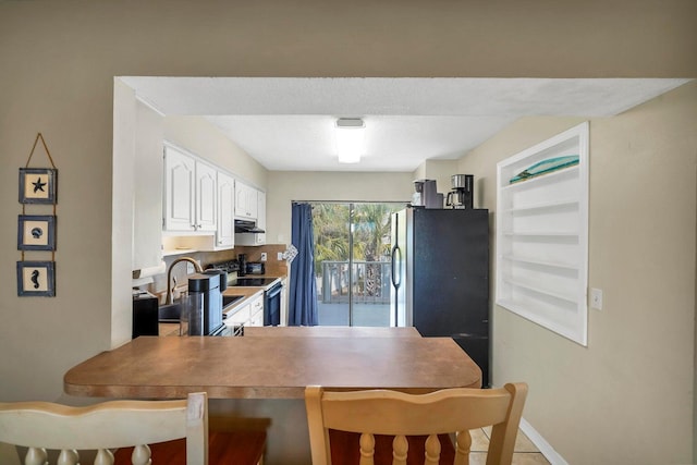 8468 Gulf Blvd # Ut-4, Navarre, FL 32566 - kitchen with sink, electric range, range hood, white cabinets, and built in shelves