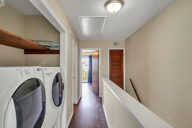 8468 Gulf Blvd # Ut-4, Navarre, FL 32566 - washroom featuring dark hardwood / wood-style floors, washer and clothes dryer, and a textured ceiling