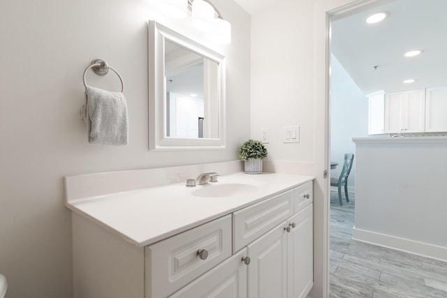 bathroom featuring vanity and hardwood / wood-style floors