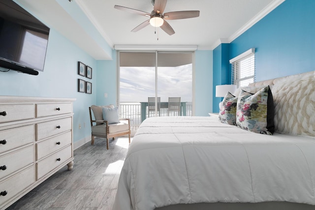 bedroom with ceiling fan, floor to ceiling windows, dark hardwood / wood-style floors, ornamental molding, and access to outside