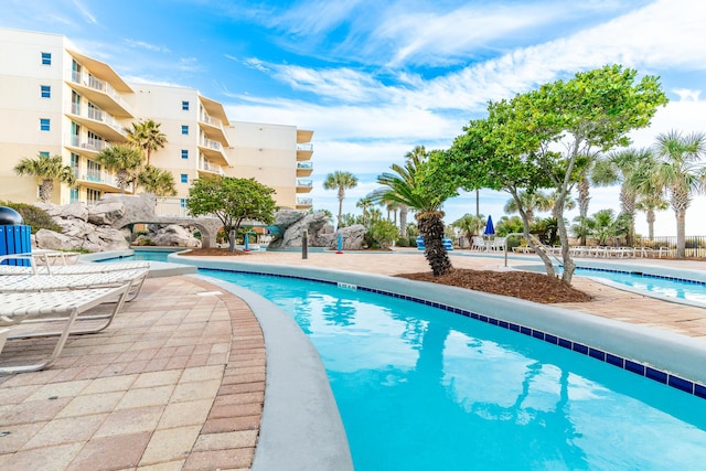 view of swimming pool featuring a patio