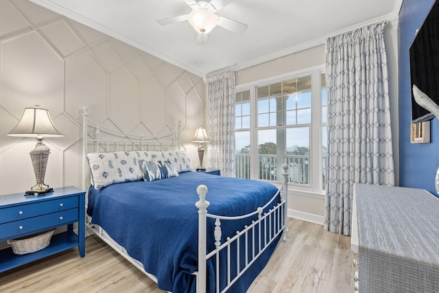 bedroom featuring ceiling fan, ornamental molding, and light hardwood / wood-style floors