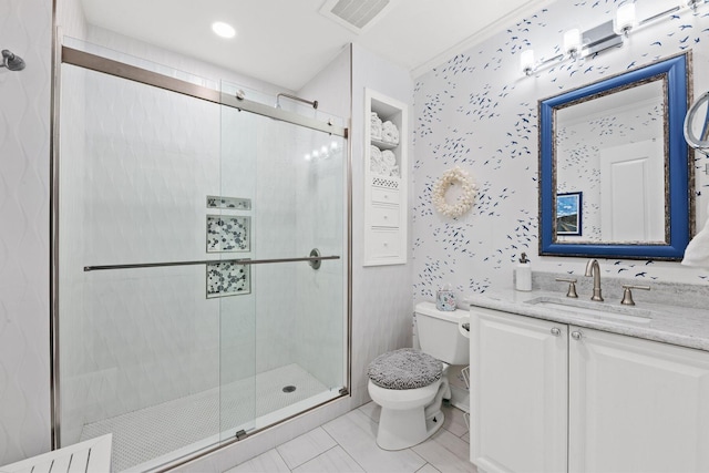 bathroom with vanity, an enclosed shower, and toilet