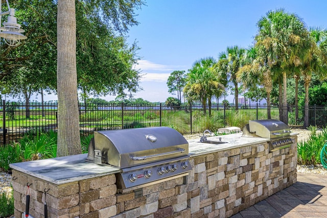 view of patio / terrace featuring area for grilling and exterior kitchen