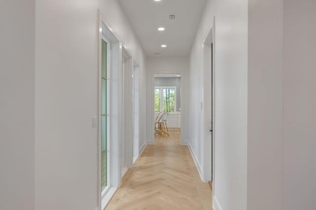 hallway with light parquet flooring