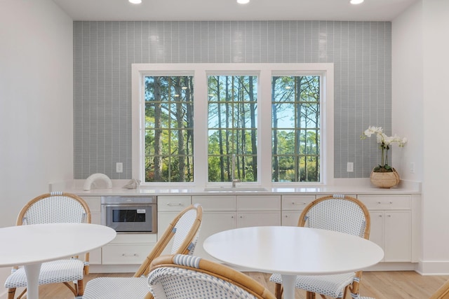 dining space with light hardwood / wood-style flooring