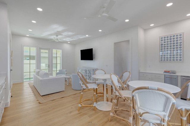 dining room featuring light hardwood / wood-style floors and ceiling fan