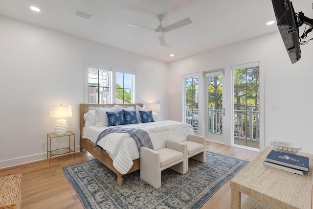 bedroom featuring access to exterior, light hardwood / wood-style floors, and ceiling fan