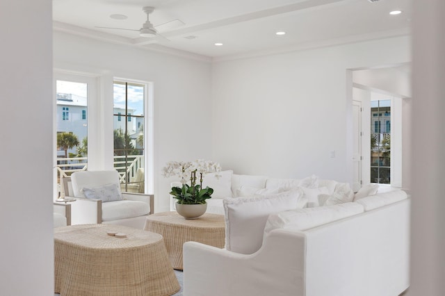 living room featuring crown molding and ceiling fan