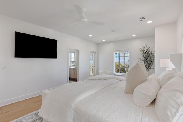 bedroom with ceiling fan and light hardwood / wood-style floors