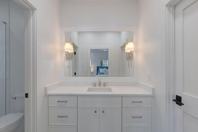 bathroom featuring vanity and toilet