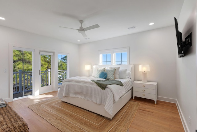 bedroom with access to exterior, light hardwood / wood-style flooring, and ceiling fan