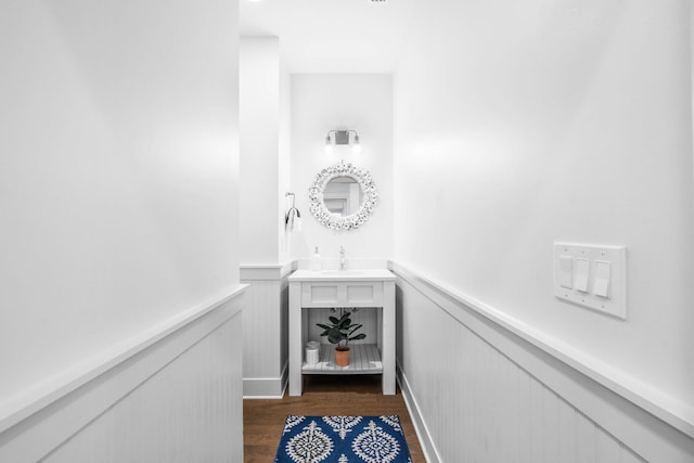 hallway featuring dark hardwood / wood-style flooring and sink