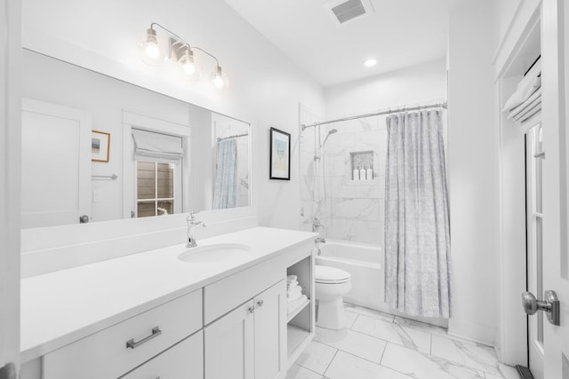 full bathroom featuring toilet, shower / bath combination with curtain, and vanity