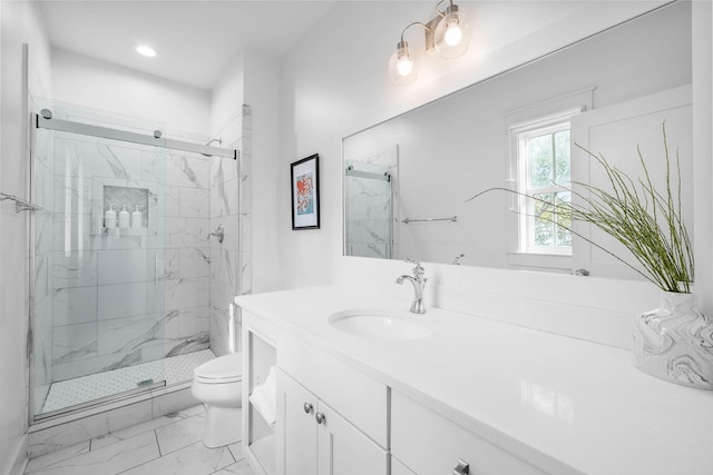 bathroom featuring vanity, toilet, and walk in shower