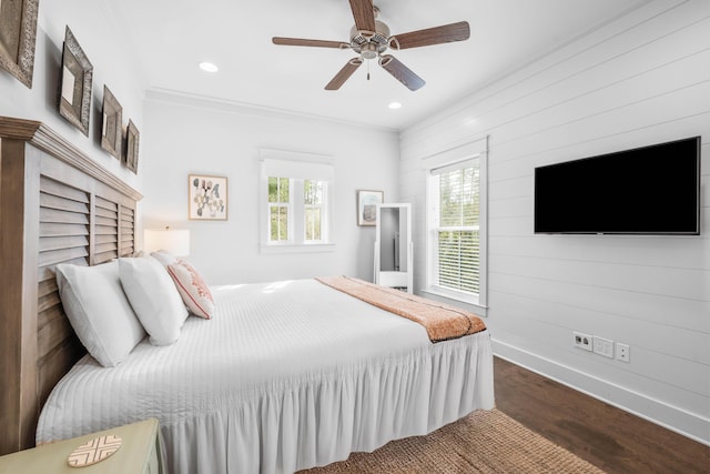 bedroom featuring ceiling fan, crown molding, and dark hardwood / wood-style floors