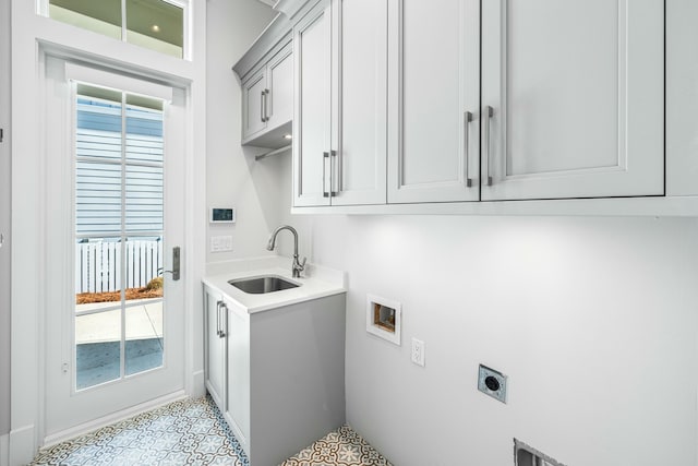 laundry area with cabinets, electric dryer hookup, sink, and washer hookup