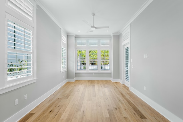 spare room with crown molding, ceiling fan, and light hardwood / wood-style flooring