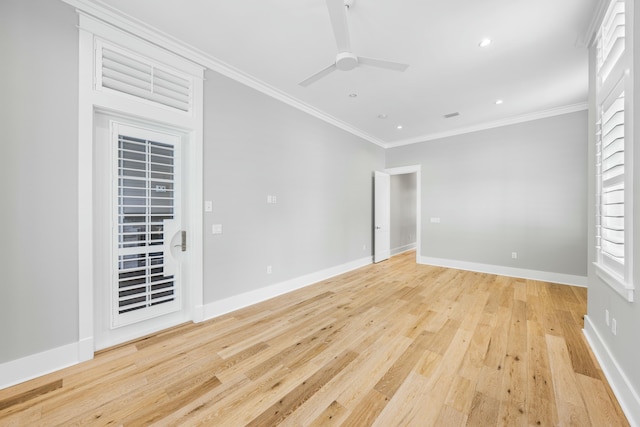 unfurnished room featuring ornamental molding, ceiling fan, and light wood-type flooring