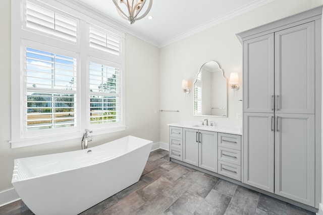 full bath with ornamental molding, a freestanding tub, a closet, and vanity