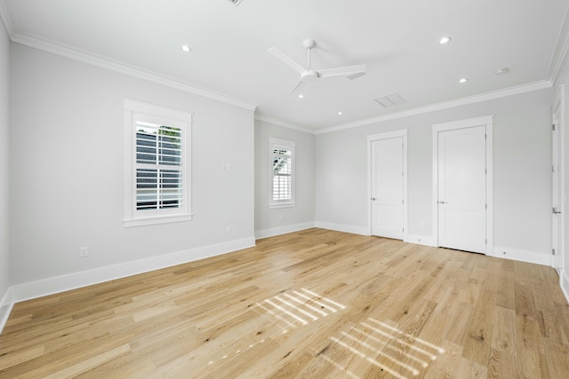 unfurnished bedroom with baseboards, light wood-style flooring, and crown molding