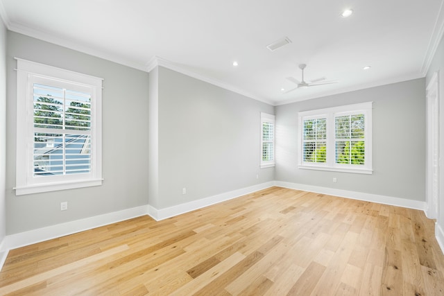 spare room featuring baseboards, visible vents, light wood-style flooring, crown molding, and recessed lighting